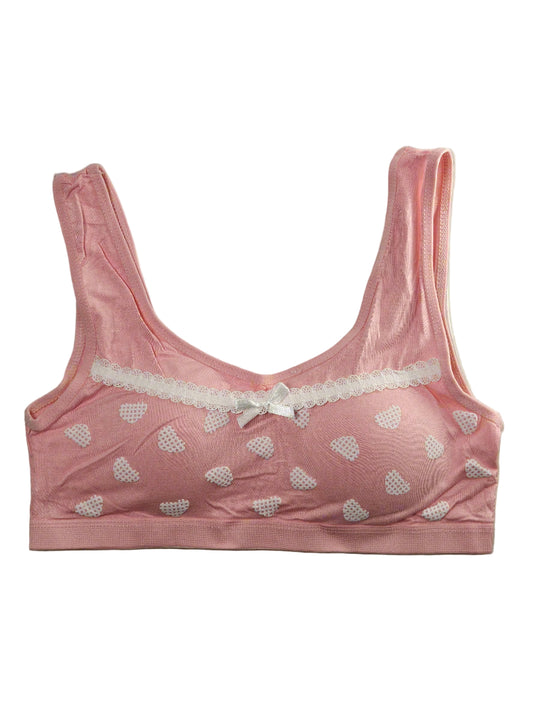 Pink bra with heart patterns on a white background