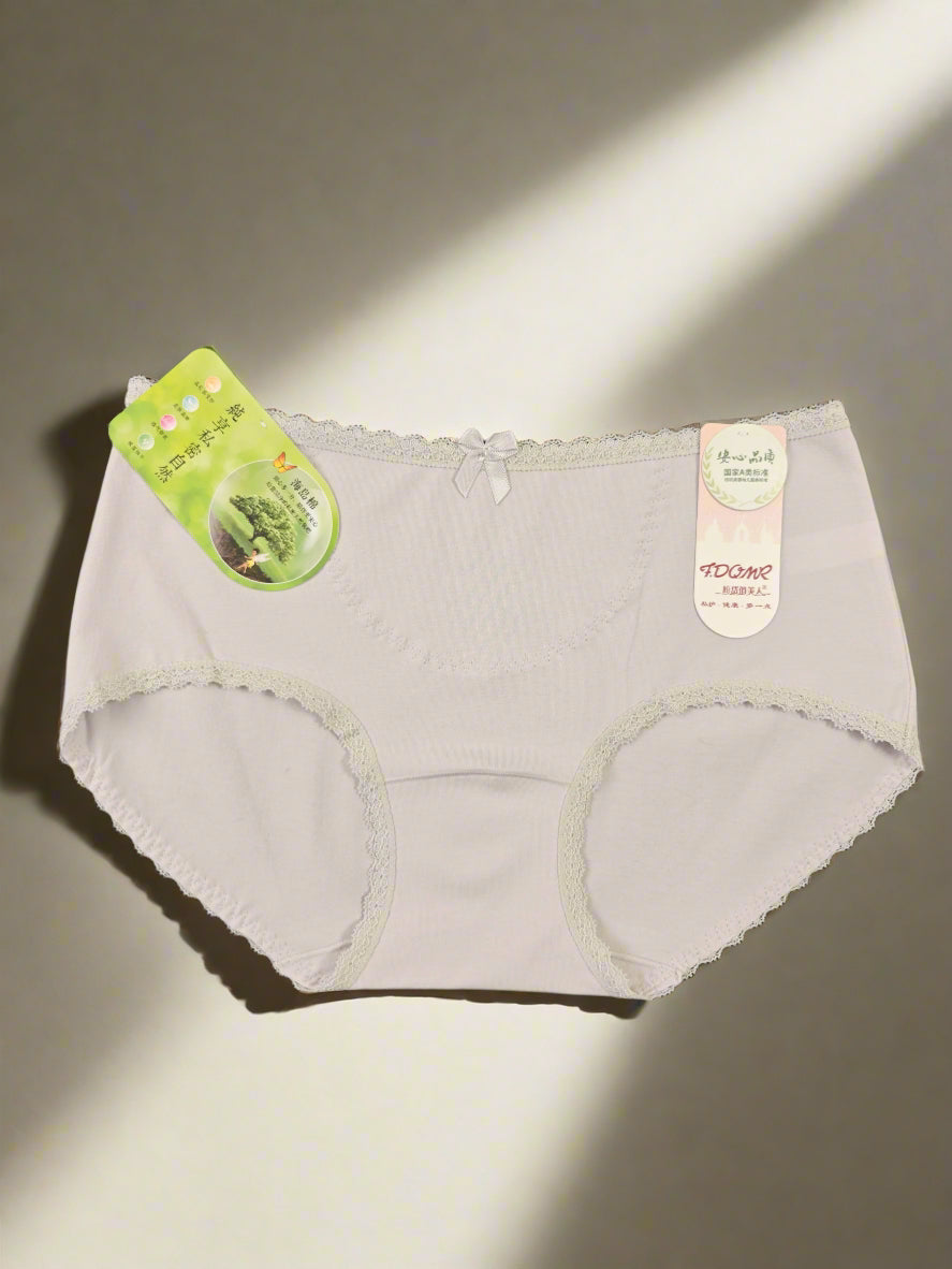 Light gray women's underwear with tags on a dark background