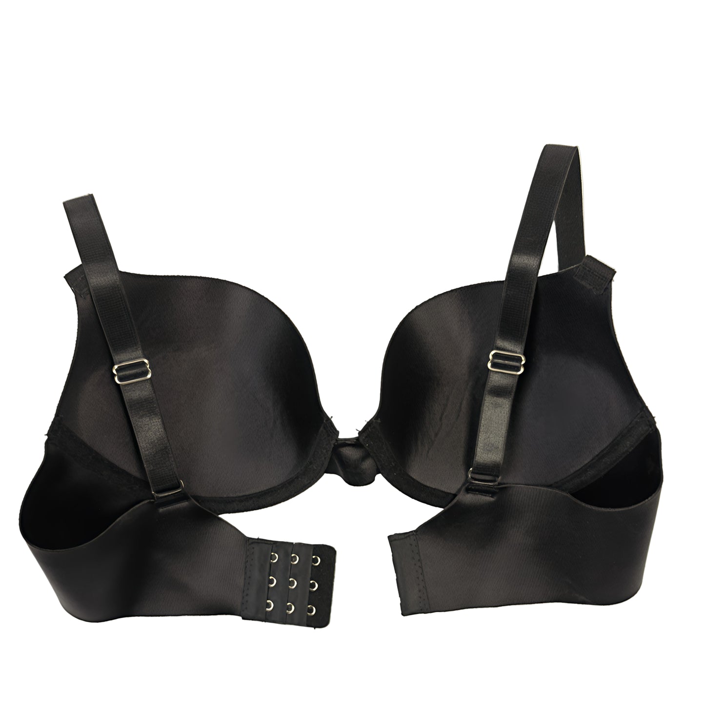 Black bra with adjustable straps on a light beige background