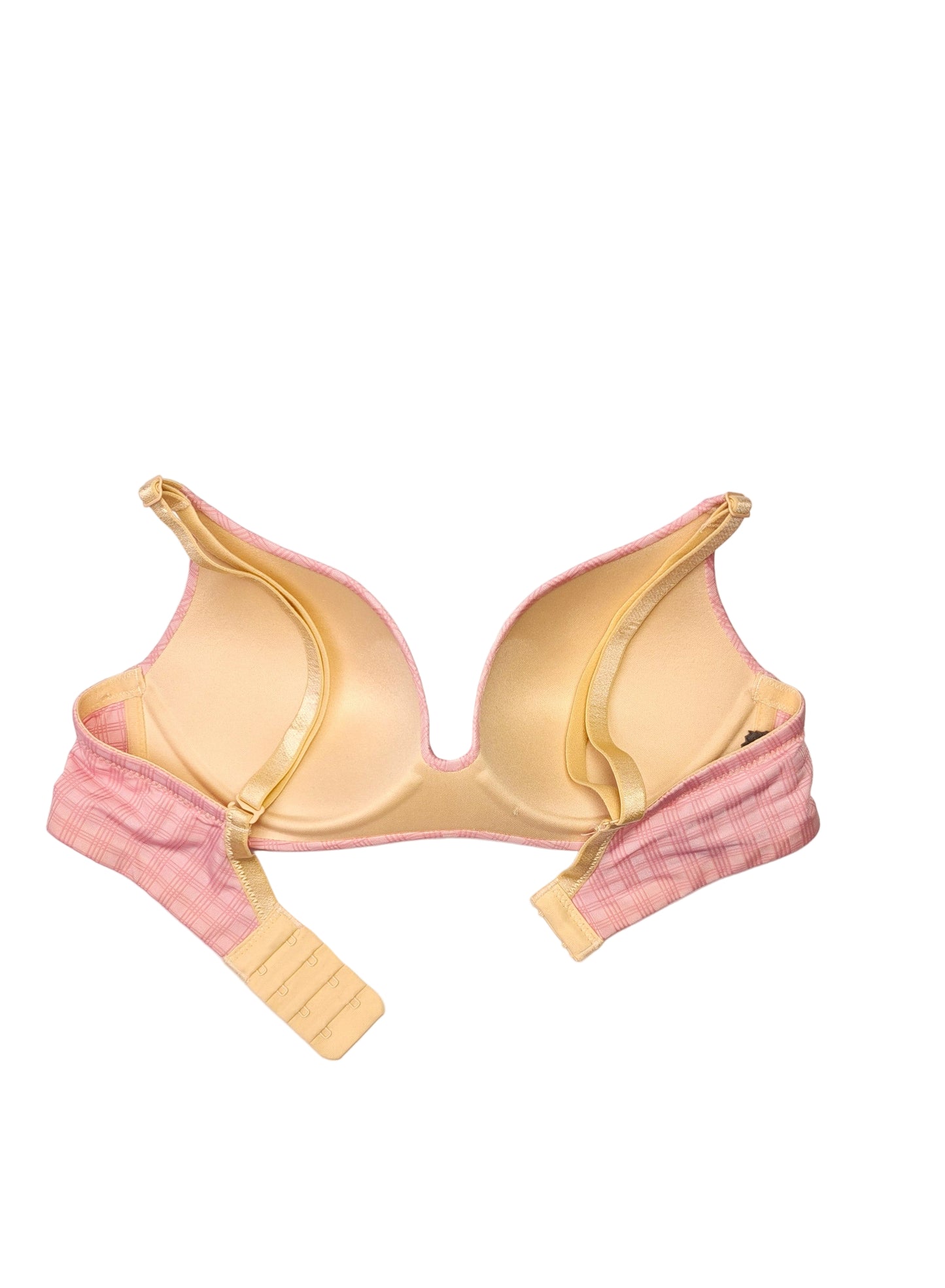 backside of pink bra on a white background