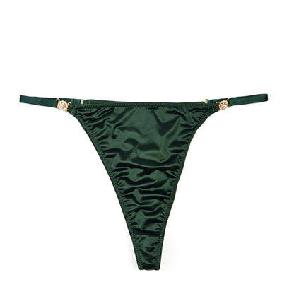 Green satin thong with gold accents on a white background