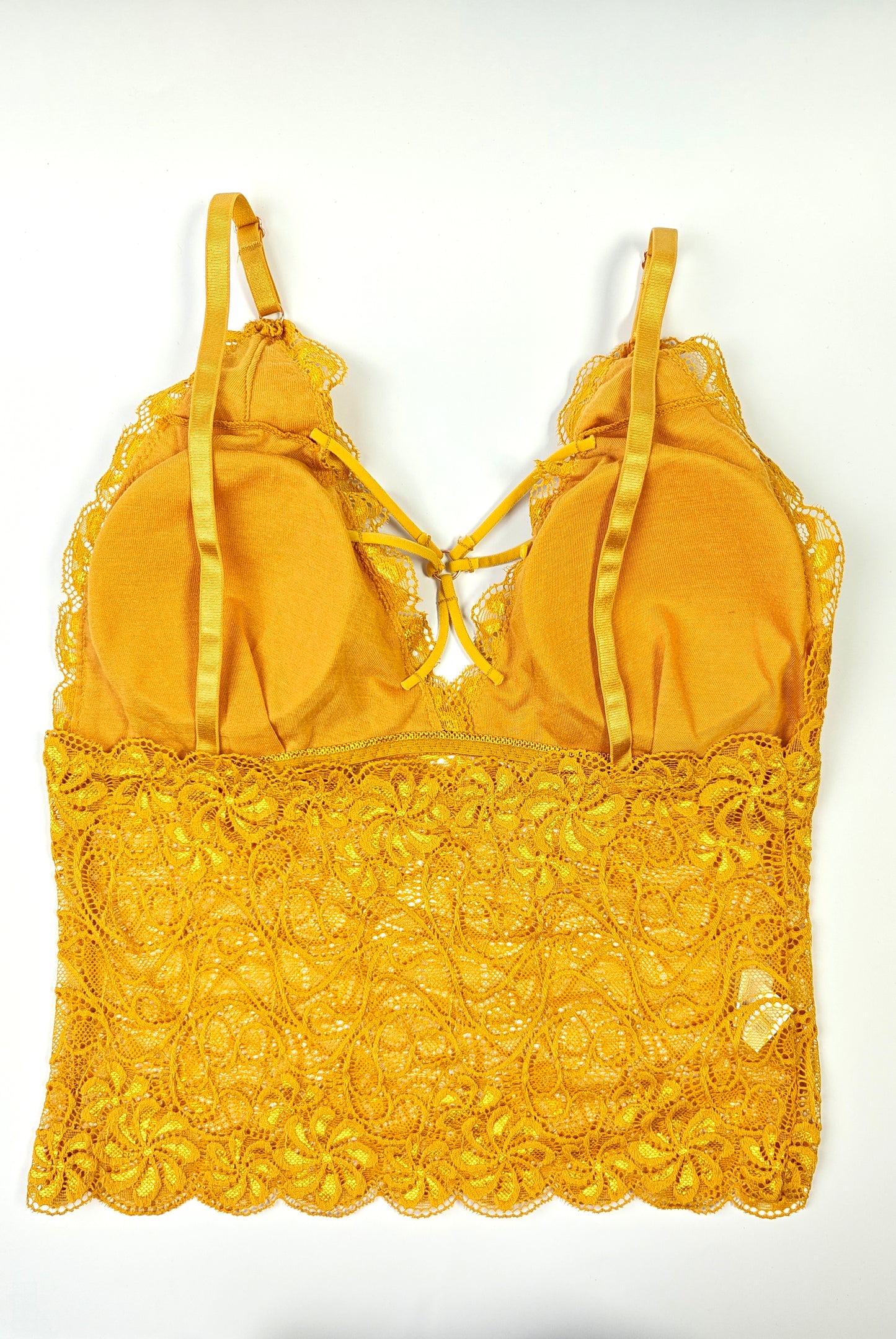 Yellow lace-trimmed top on a white background