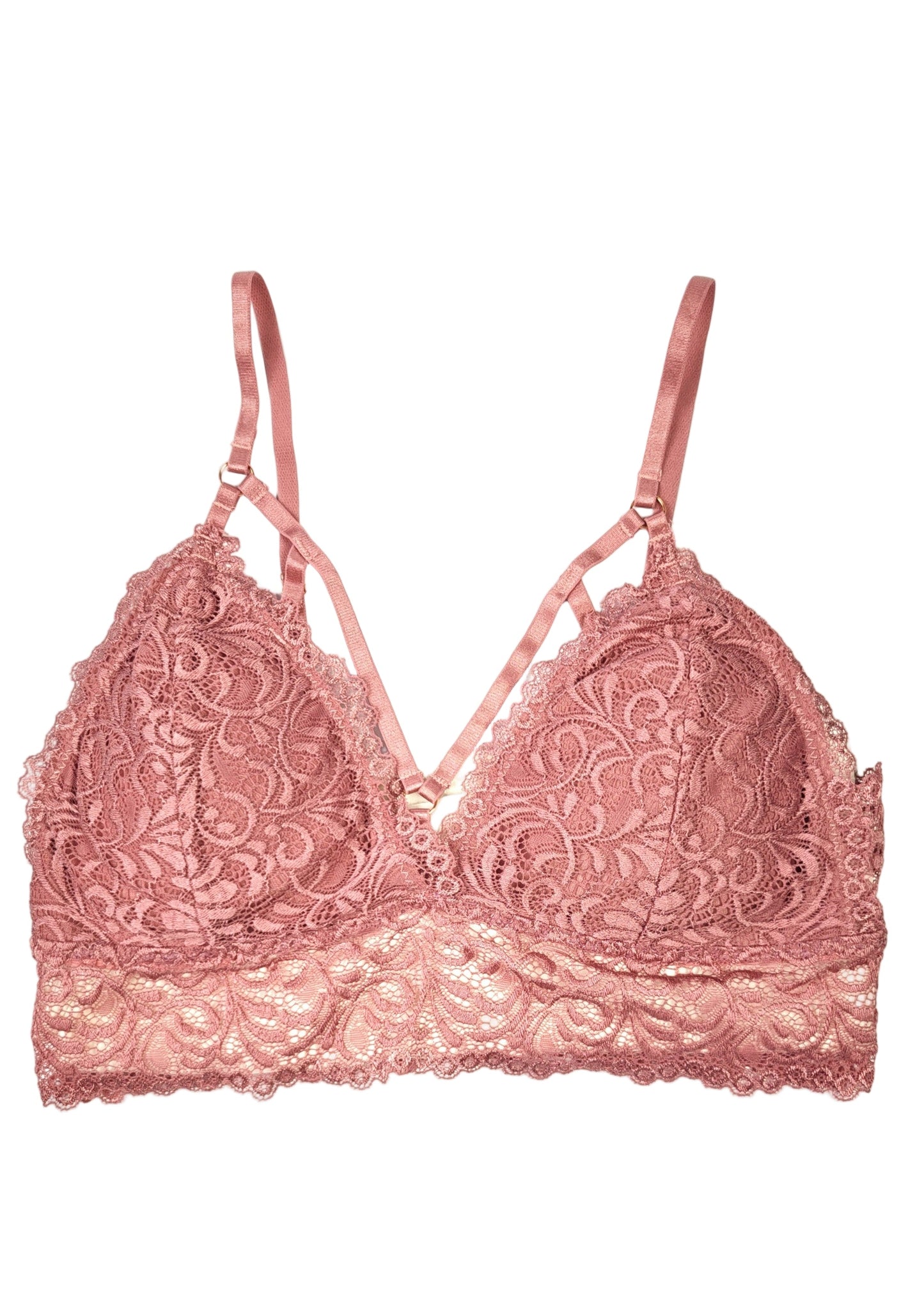Pink lace bra on a white background