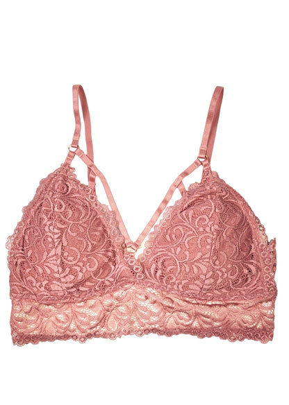 Pink lace bra on a white background