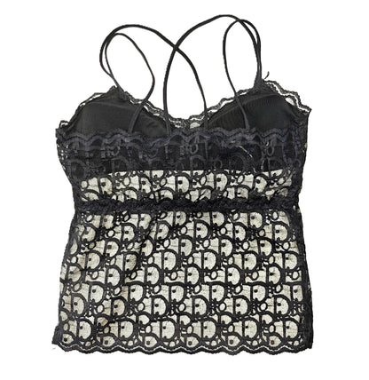 a black lace longline bralette on a white background