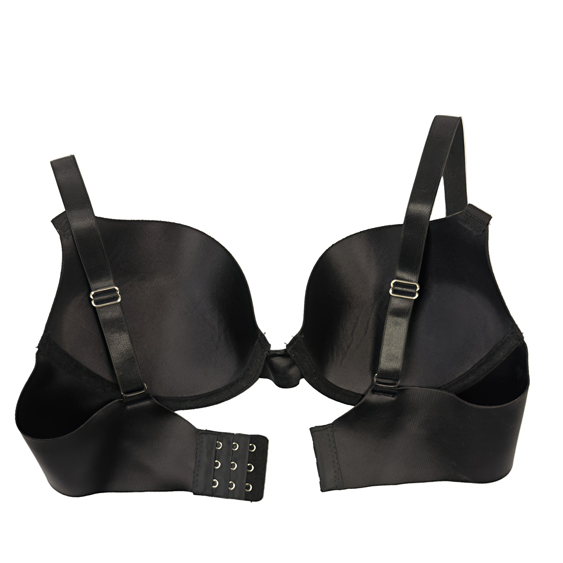 Black bra with adjustable straps on a light beige background