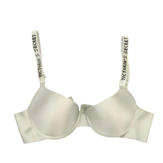 White bra with 'Victoria's Secret' branding on a white background